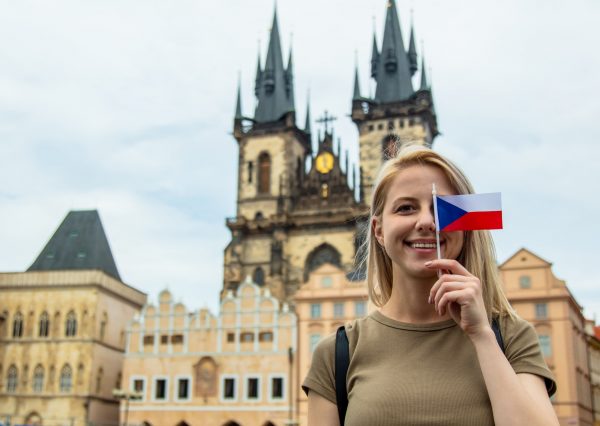 blonde-woman-with-a-flag-at-central-square-in-prague-czech-republic